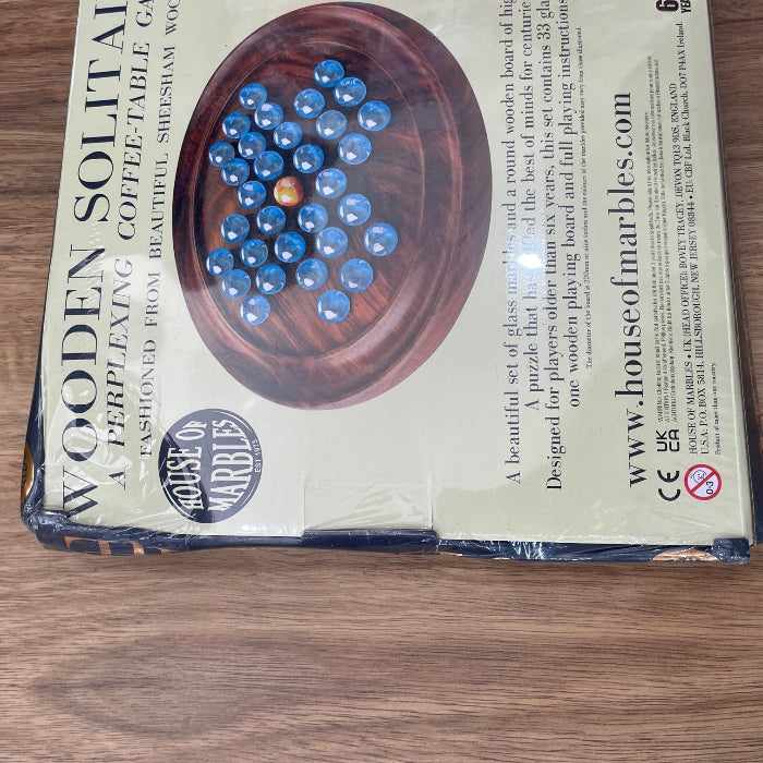 Damaged packaging wooden solitaire