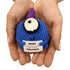 hands holding a handmade crochet blue cyclops plush toy with a humorous sarcastic quote sign