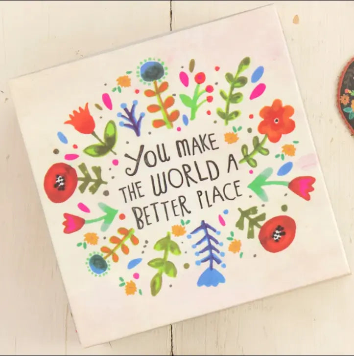Floral quote plaque featuring “You Make the World a Better Place” surrounded by colourful flowers and leaves