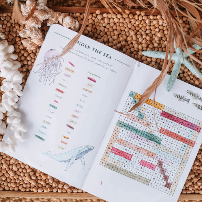 Wild Activity Book open to an under the sea word search with colourful marine life illustrations — Adventure Awaits