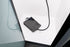 Grey caravan trailer plug cover used on shower head on shower floor — Adventure Awaits