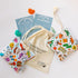 Ouchie Pouchie cold pack set with two illustrated packs, cotton bag, activity cards and crochet hearts — Adventure Awaits