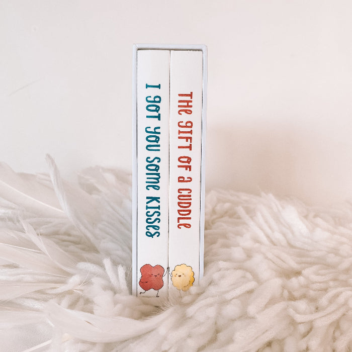book spines for I Got You Some Kisses and The Gift of a Cuddle in white slipcase