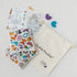 Ouchie Pouchie cold pack set with colourful illustrated pouches, cotton drawstring bag and activity cards — Adventure Awaits