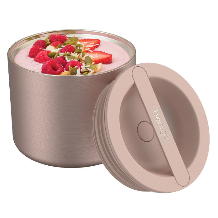 Bentgo blush pink insulated food container filled with berry yoghurt, airtight lid beside it — Adventure Awaits