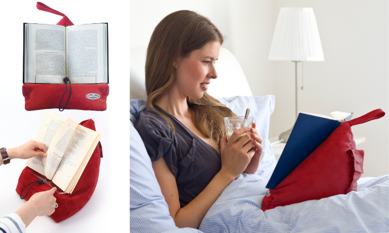 Red The Book Seat holding books hands-free in bed and on a table — Adventure Awaits