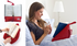 Red The Book Seat holding books hands-free in bed and on a table — Adventure Awaits