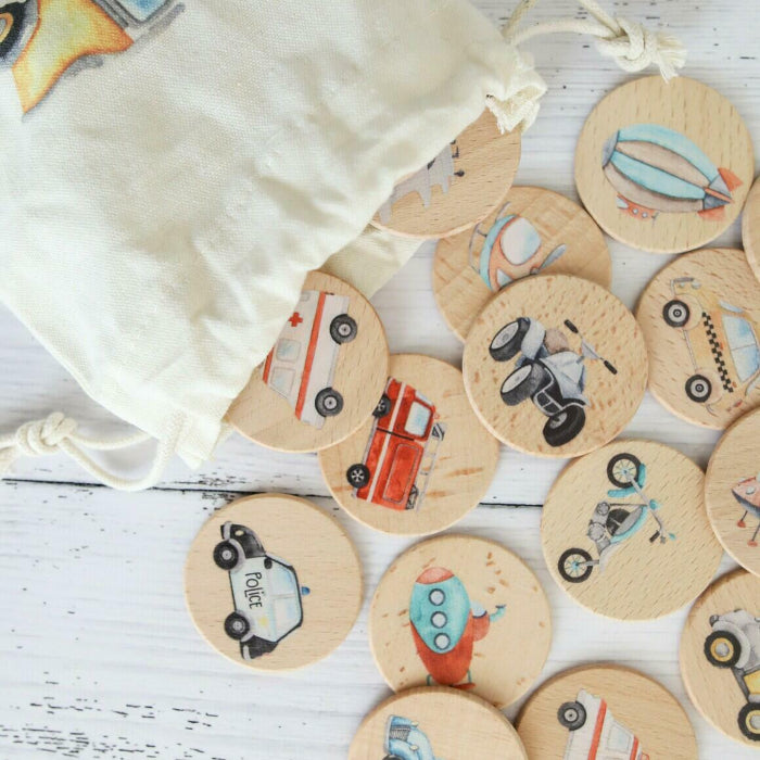 close up of some of the transport wooden memory discs white calico bag in top corner of image
