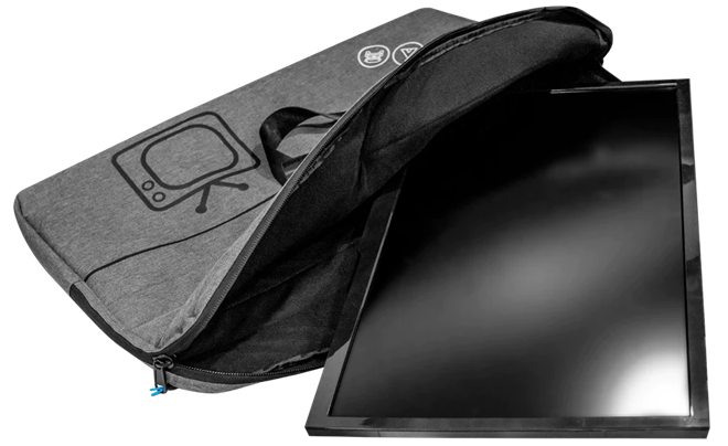 Grey padded caravan TV storage bag open with TV sliding inside — Adventure Awaits