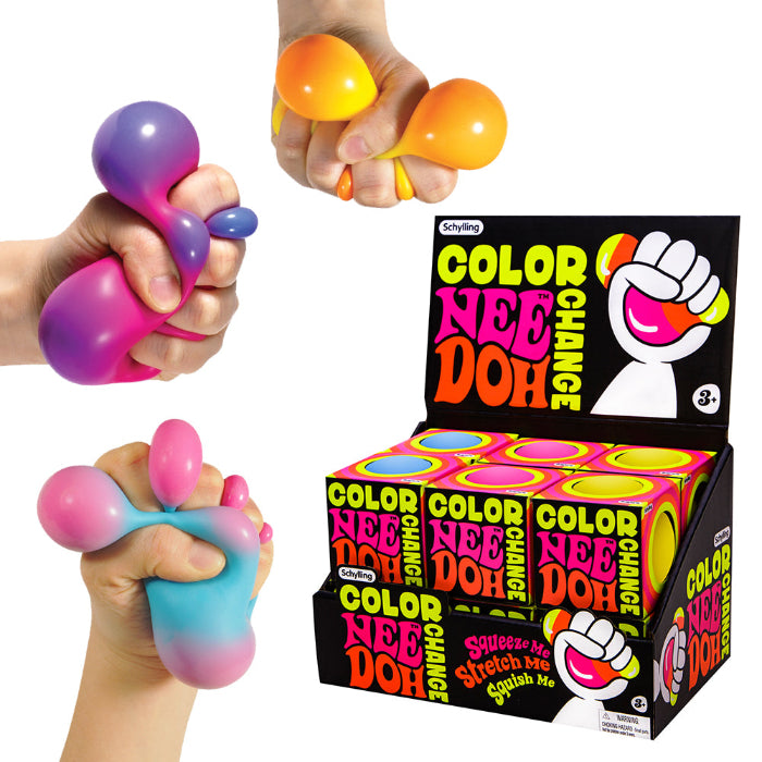 Hands squeezing colourful NeeDoh colour-change sensory balls beside the display box, Adventure Awaits