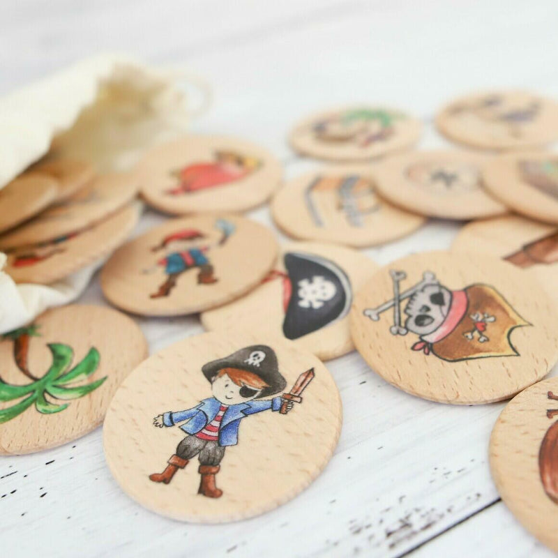 Pirate memory game wooden discs close-up with illustrated pirate characters — Adventure Awaits
