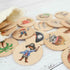 Pirate memory game wooden discs close-up with illustrated pirate characters — Adventure Awaits