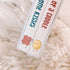 Close-up of board book spines for I Got You Some Kisses and The Gift of a Cuddle — Adventure Awaits