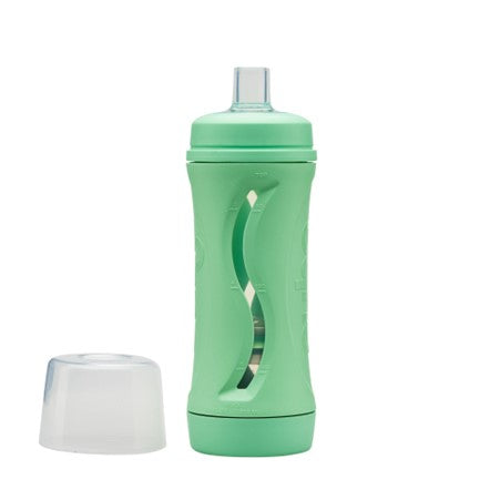 mint subo the food bottle shown with lid removed and sitting beside the bottle on a white background