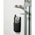 tooletries henry essentials holder with toothbrush and toothpaste stuck beside shower head