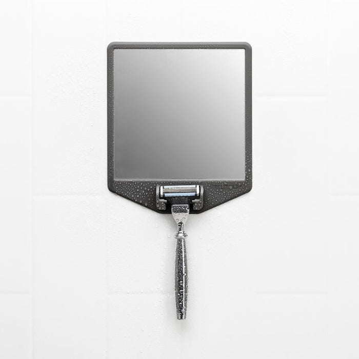 tooletries the joseph shaving station with razor hanging shown on white shower wall covered in water droplets