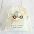 bag of wooden transport memory discs on white timber background
