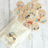 wooden transport discs emptied out of bag on white timber bench top